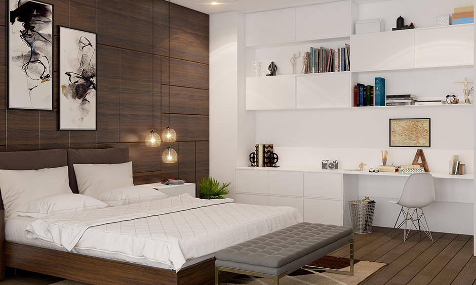 Wooden flooring brings in warmth and elegance in this modern master bedroom with study unit