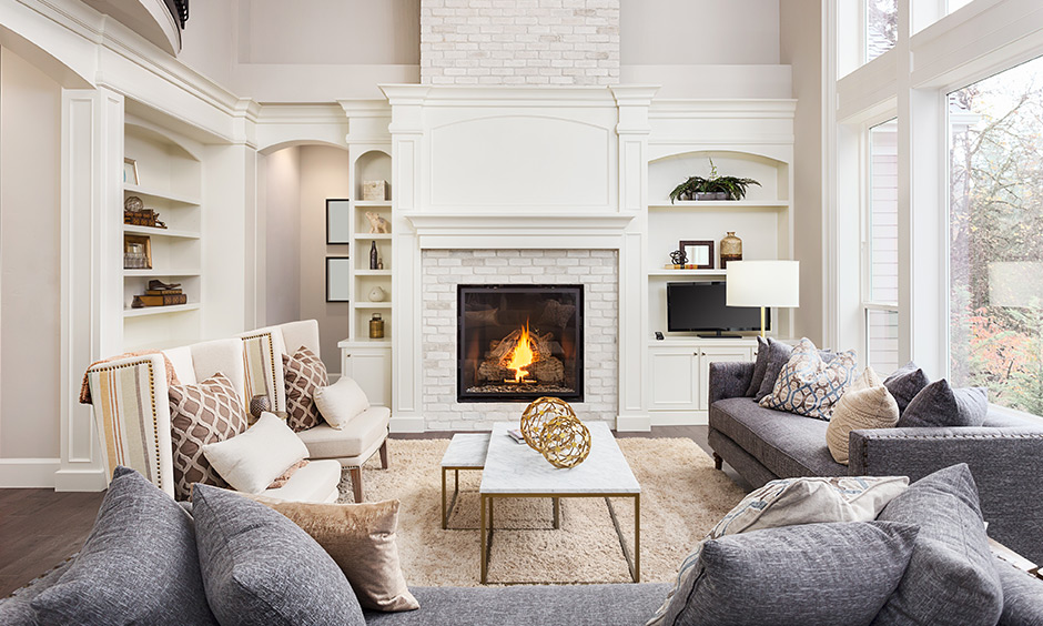 Angelic living room decor with a white colour scheme and stone cladded chimney