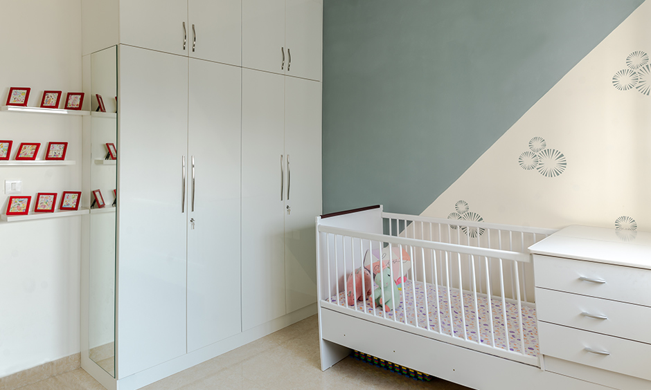 Design cafe designed this kids bedroom for prestige falcon city interior in Kanakapura road with glossy white laminate.