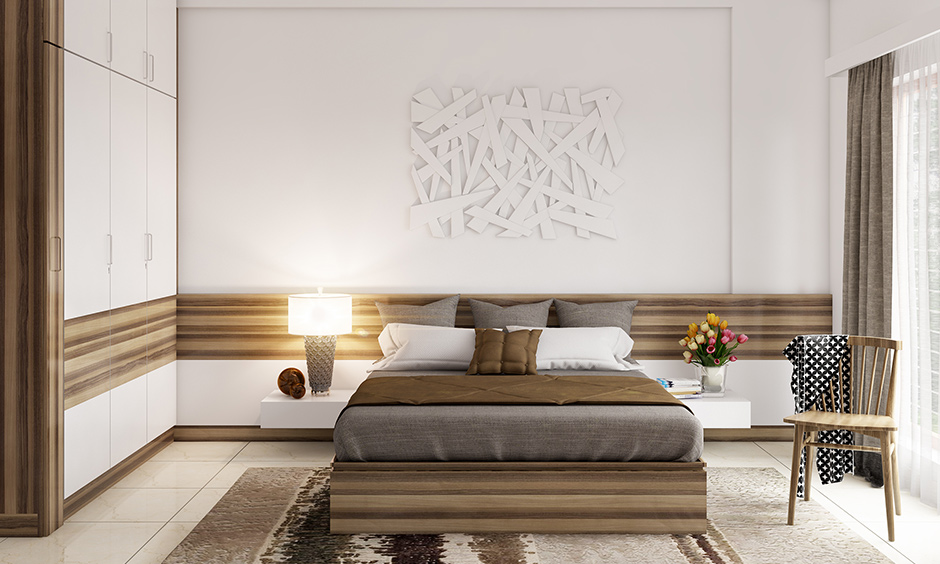 Master bedroom wall art with an abstract white piece of art made from wood placed above the bed looks elegant.