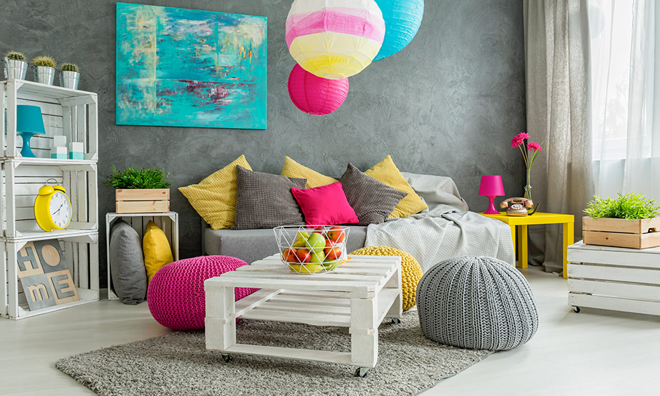 Colourful Diy wall hanging ideas and a painted canvas can pep up your dull grey wall in the living room.