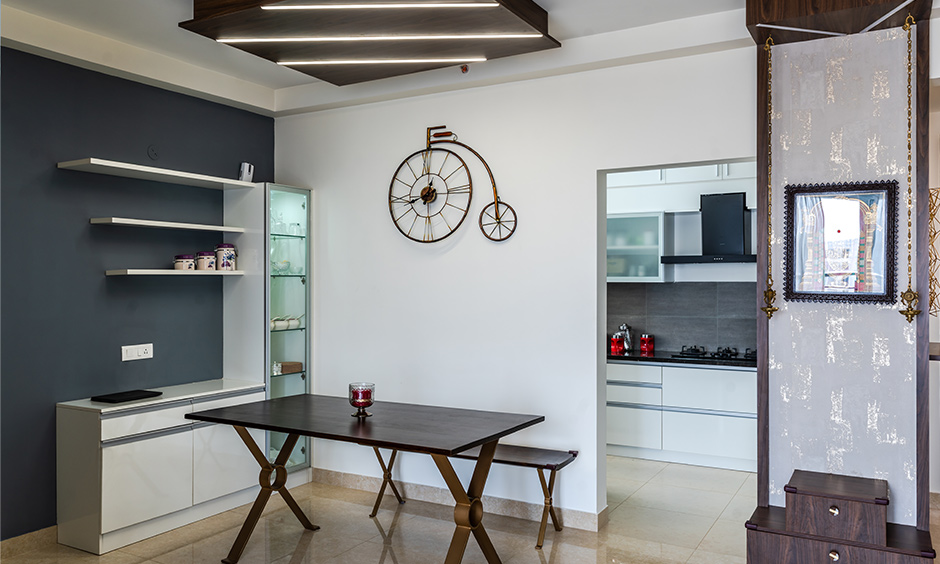  Interior designers in Kanakapura road designed this industrial style dining room with dark walnut dining table.