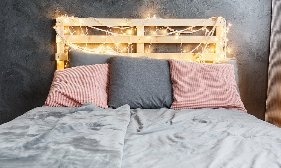 DIY headboard design with crates makes cosy vibe to this bedroom bed