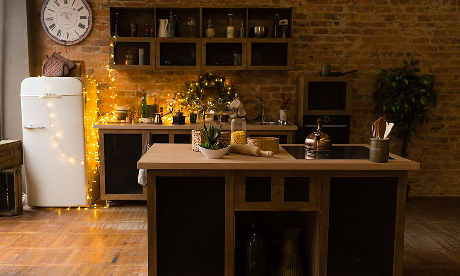 Rustic small kitchen island decor ideas with fairy lights across the kitchen counter & brick-walled feel warm and fuzzy.