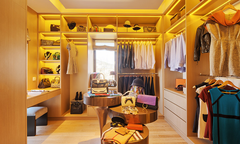 Modern wardrobe interior design for women with dressing table, plenty of storage & lightings is perfect