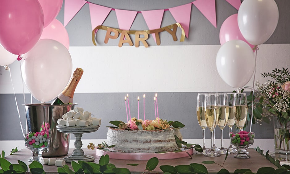 Simple DIY party decorations at home with balloons, paper art, succulents, lights and flowers