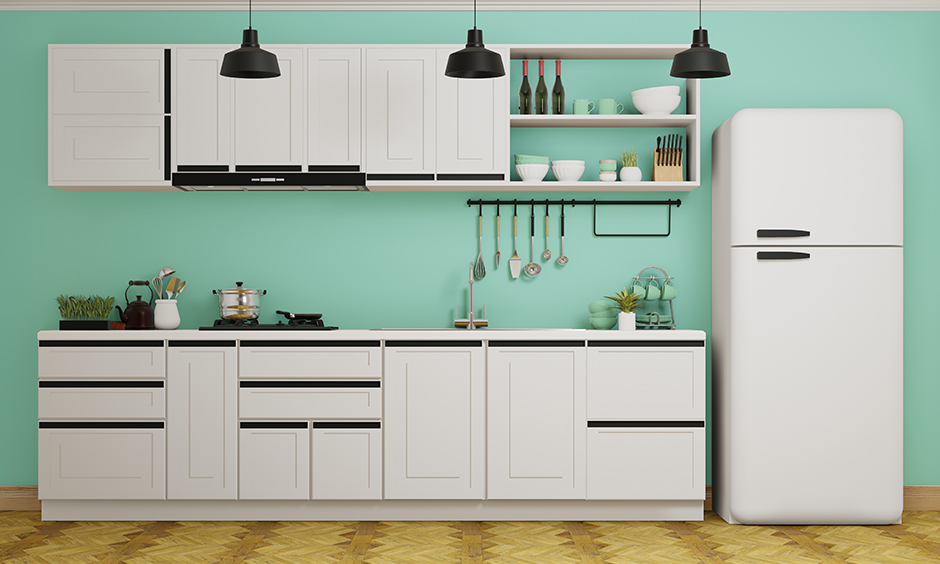 Small kitchen wall decor idea with pistachio green accent merges beautifully with the white kitchen interiors