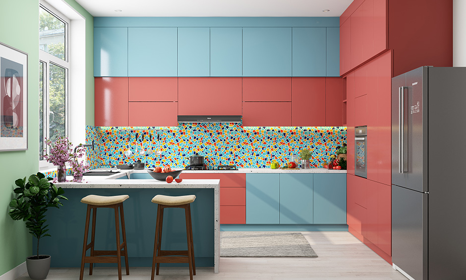 Bold g shaped kitchen layout with colourful backsplash with LED strip lighting with overhead cabinets