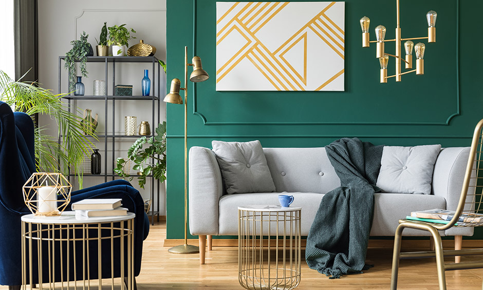 Dark accent wall living room with beautiful wall mouldings adds to the sophistication of this space.