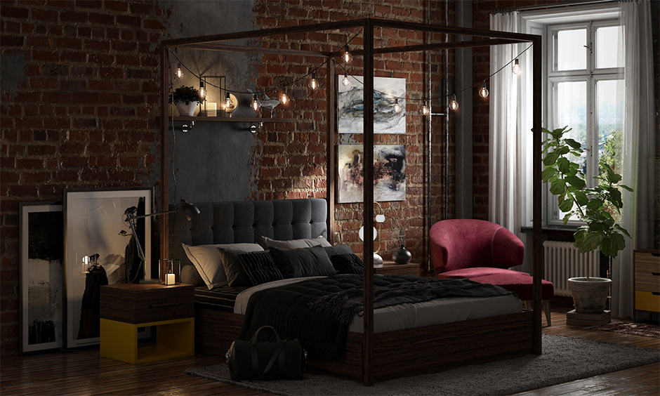 A four poster bed in the industrial-style bedroom with string lights