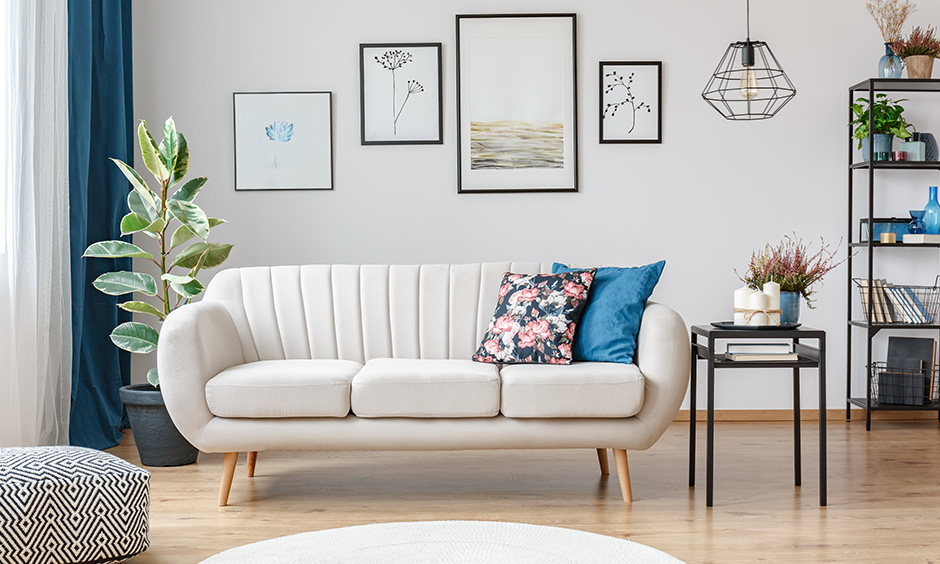 The mid-century modern white sofa is super easy to clean and can easily blend in every style and size of the living room.