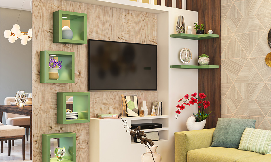 Tv unit with shelves and open cabinets for storage is partition design for living room and dining hall.