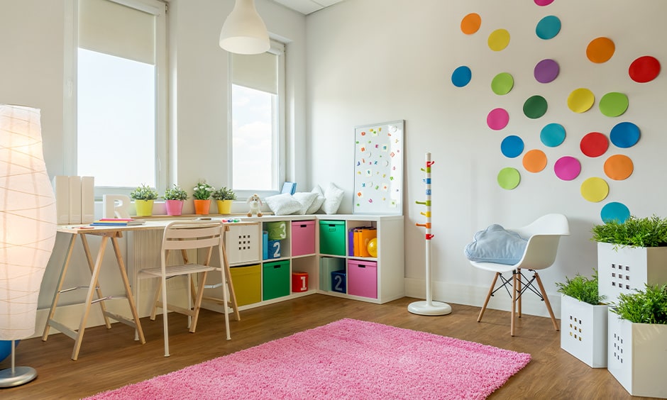 Small children room decorating ideas with a white-walled decorated with different coloured paper