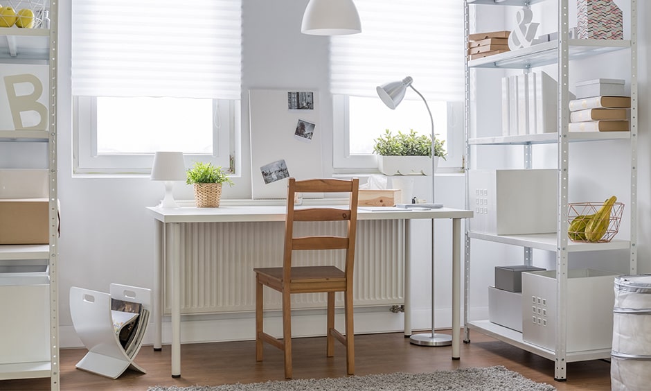 Study table decoration with white furniture and indoor plants in a pot