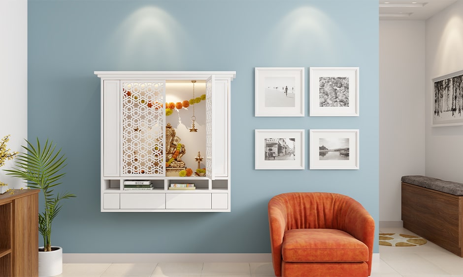 Wall mounted mandir design ideas with jali doors and bottom shelves