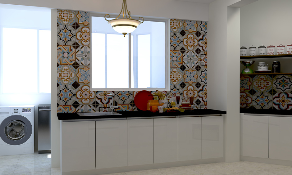 Moroccan tiles with a riot of colours manage to add funkiness to the all-white kitchen is the Moroccan tiles India.