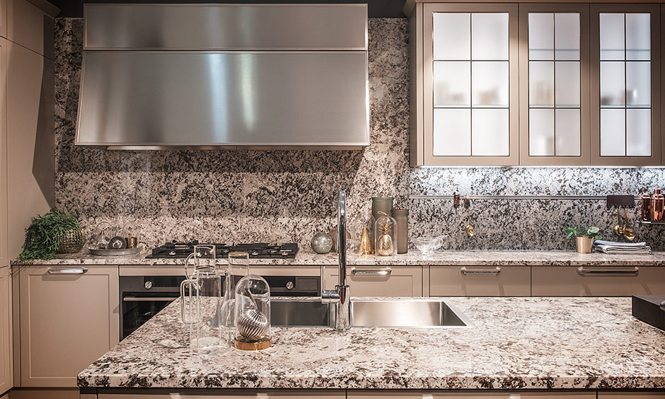 Kitchen granite countertops look beautiful and same granite is also used for the backsplash in the kitchen.