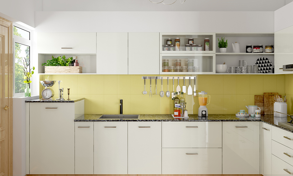 Bright white contemporary painted kitchen cabinets makes this kitchen look bright and fresh