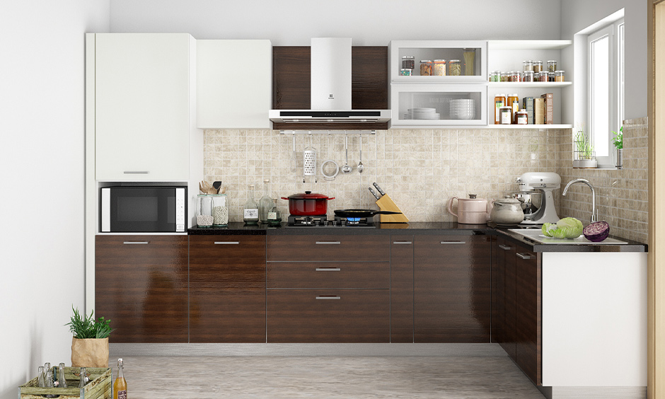 Dark modular kitchen wooden colour which is great for urban families