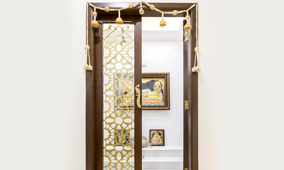 Decorative pooja door designs with glass which is inherently classy 