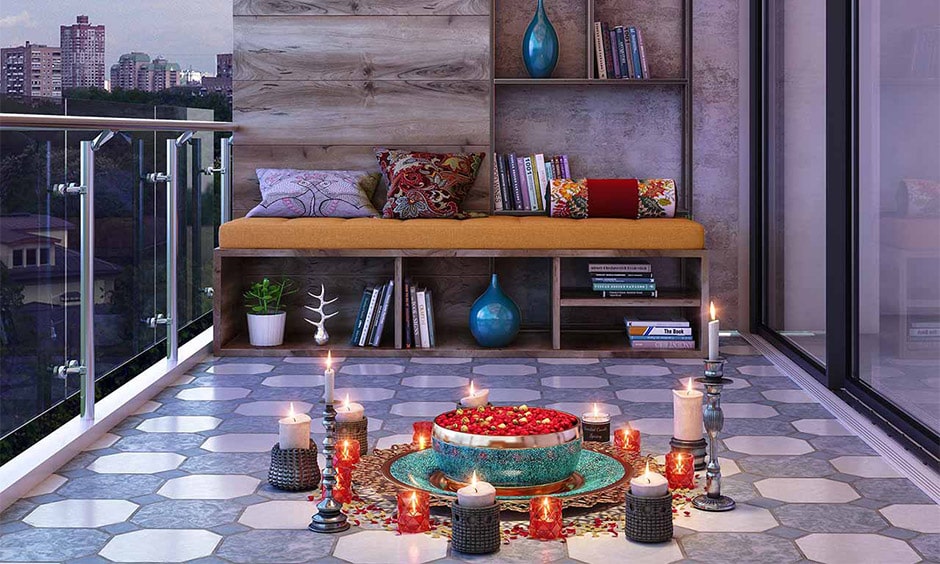 Diwali light decoration home in balcony with candles and bowl filled with petals