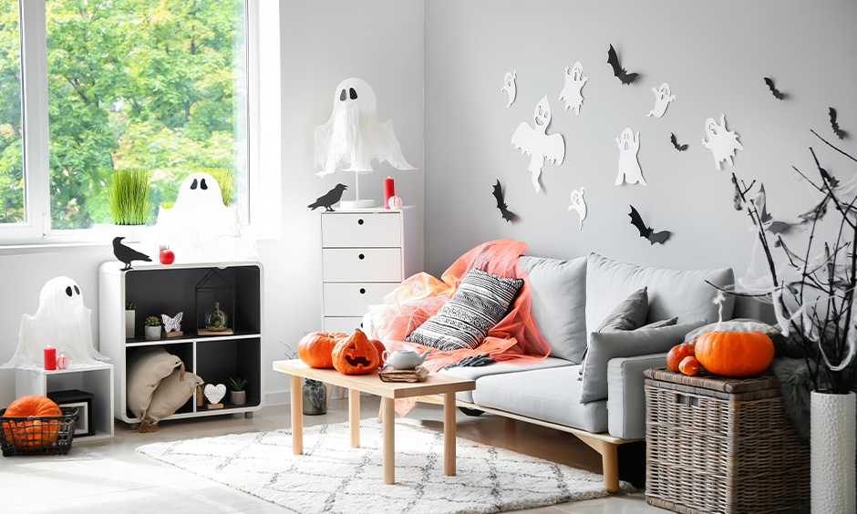 Halloween decorations on a budget, go for DIY bats and crows made from paper and stick them on the walls