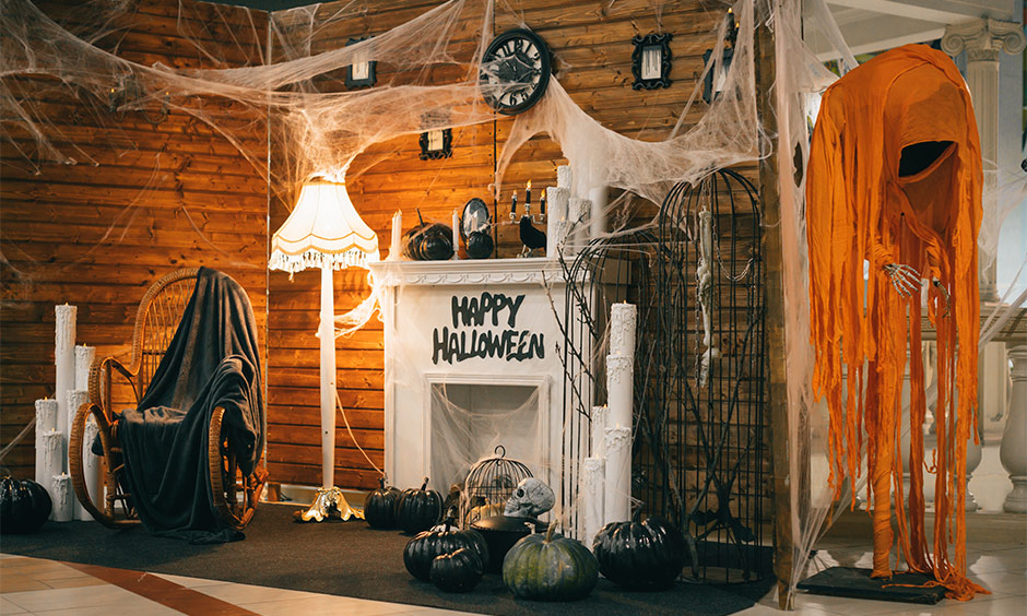 Giant spider web halloween decoration for living room with pumpkins coloured in black