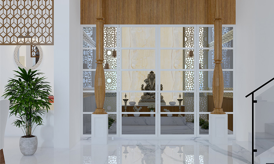 Mandir plywood design with glass door creates a magic that grows on the divine space of your pooja room.