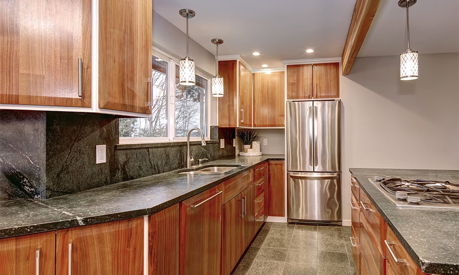 Grey granite countertop with wooden cabinets