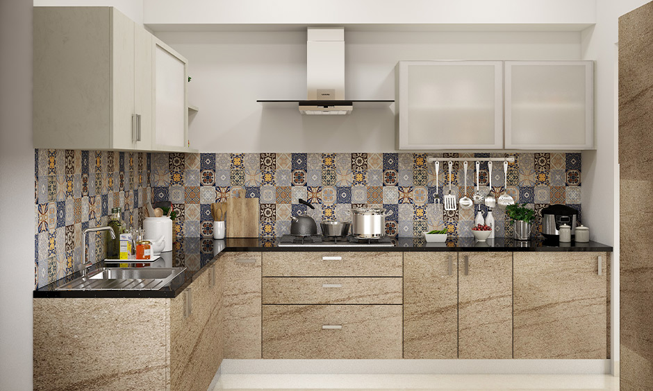 Vitrified tiles used in this kitchen backsplash in Moroccan-styled are the perfect way to the bright and cheerful kitchen.