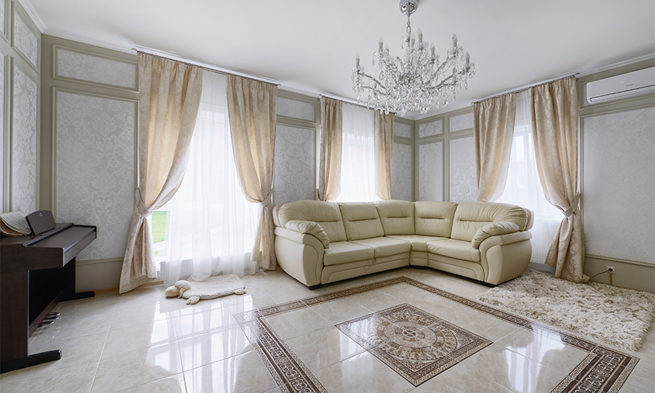 Elegantly designed living room with vitrified tiles offers excellent options in terms of style and patterns.