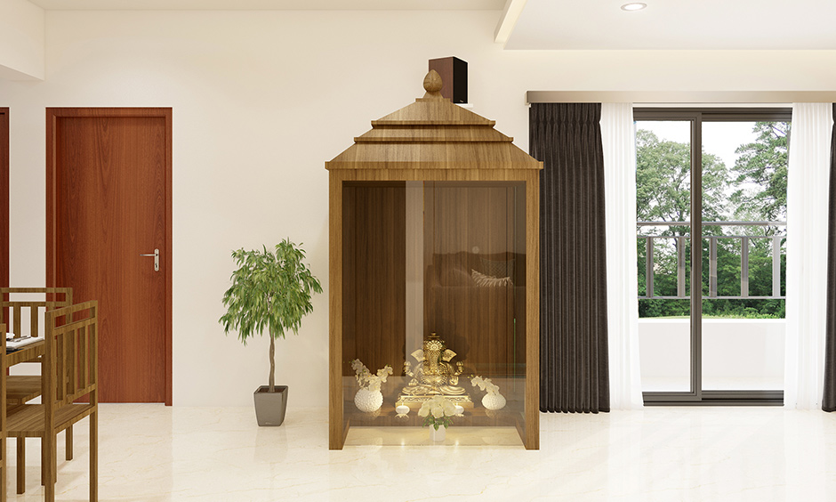 Plywood temple design for home framed with plywood and with an interplay of glass is classy.