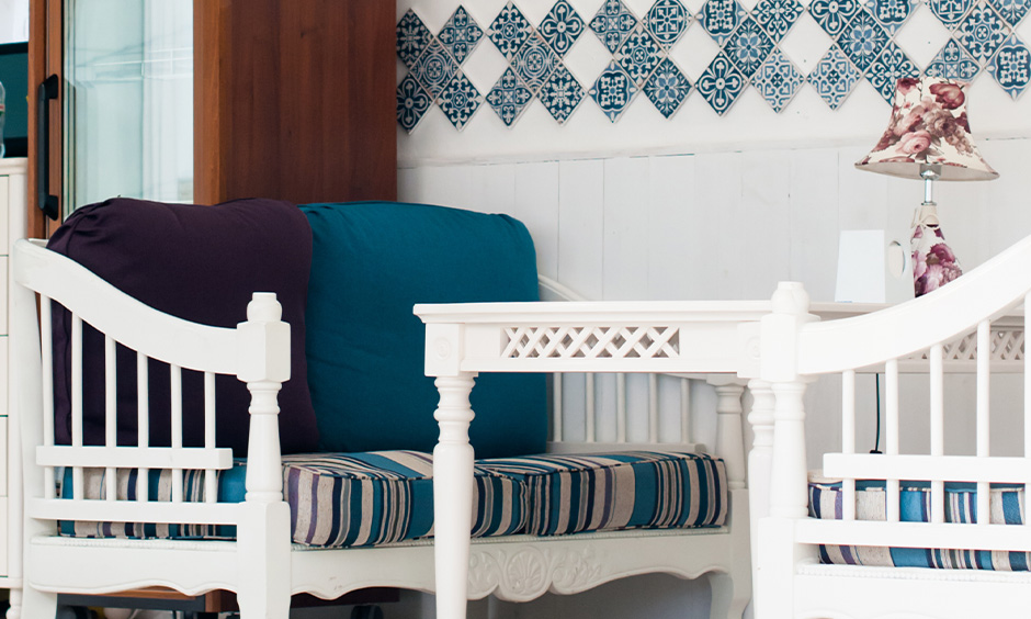 Moroccan tiles patterned are used as wall decor making the corner look strikingly beautiful in the dining area.