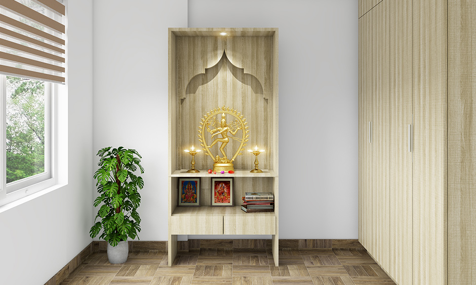 Pooja room designs in plywood simple yet traditional with integrated shelves and smartly use the space.