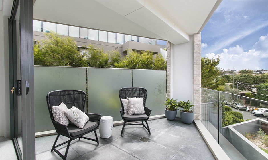 Simple vitrified tiles texture in the balcony are super easy to clean and maintain.