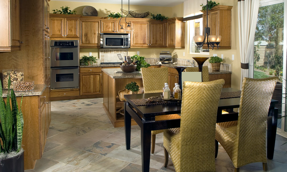 Traditional kitchen with types of vitrified tiles flooring used that brings classic appeal to the area.