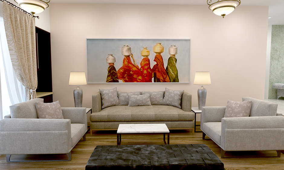 Indian home interior design ideas deck up a wall with Indian art decors like paintings, artwork, and photographs.