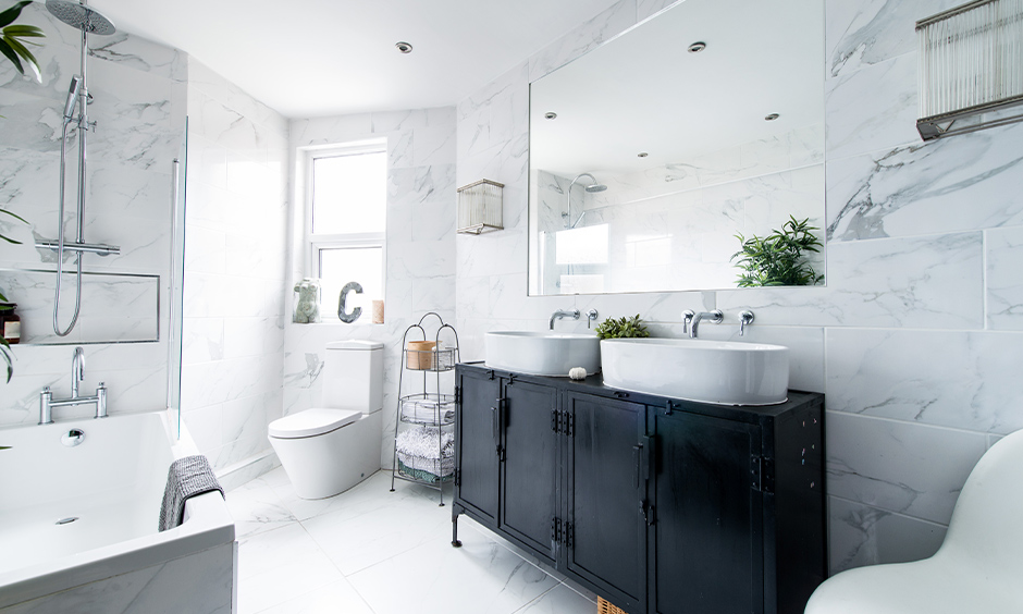 White tiles contemporary bathroom basins above metal knick-knacks and bathtub looks artistic bathroom.