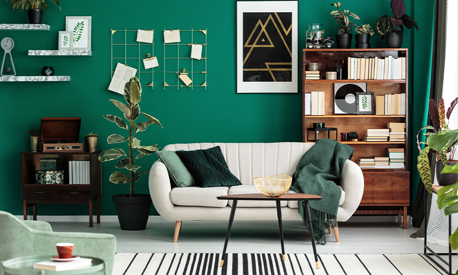 Soft teal paint color for modern living room with cosy beige sofa, antique furniture and home library add charm.