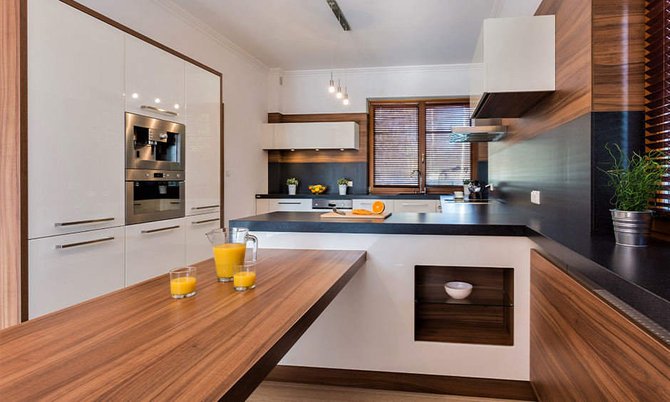 Kitchen with faux-wood laminate countertop brings in a touch of warmth and tradition into the area.