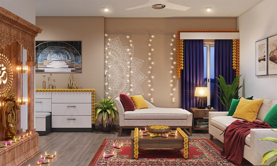 Diwali decoration ideas for living room on a neutral wall with string lights