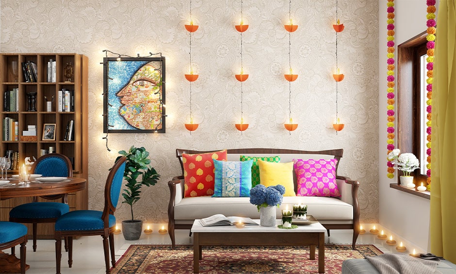 Diwali room decoration ideas with paper diyas hang on one wall