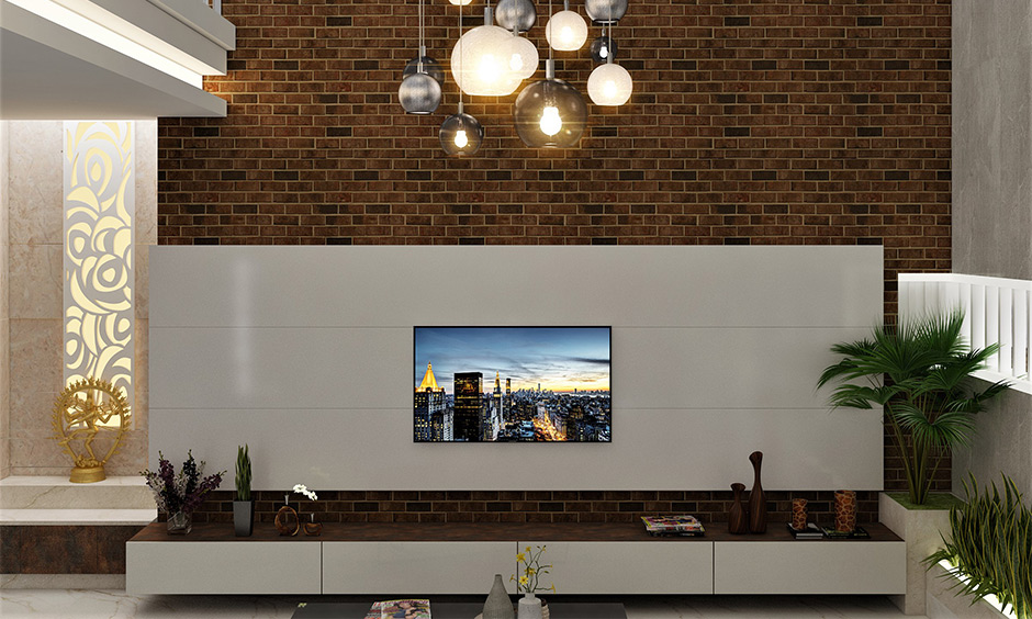 The living room has globe-shaped pendant lights in varying lengths installed decorative ceiling lights looks elegant.