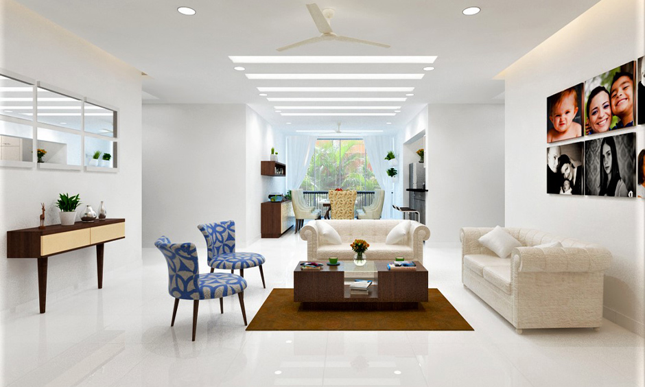 The recessed linear led decorative lights panel in this white living room are power-saving as well as space-saving.