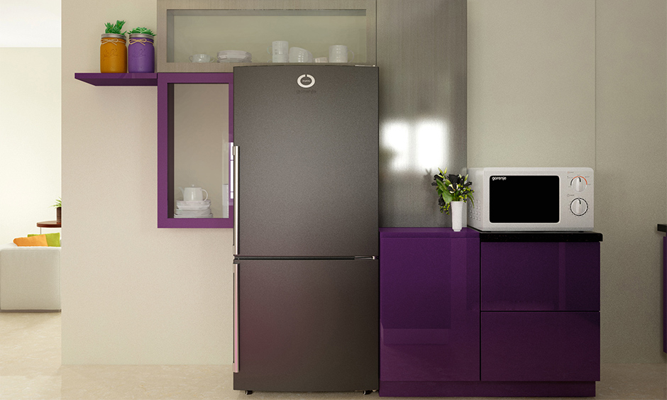 Contrasting shades of a purple colour kitchen with beige and grey add a personality to the kitchen.