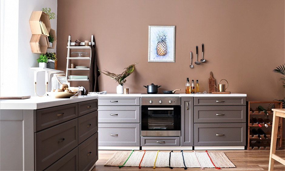 Ladder as a rack repainted and used in this kitchen counter corner shelf reflects creativity at its best.