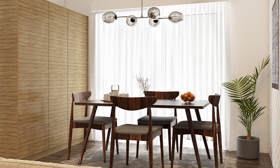 Hanging dining room light fixtures in transparent glass domes to amp up your style