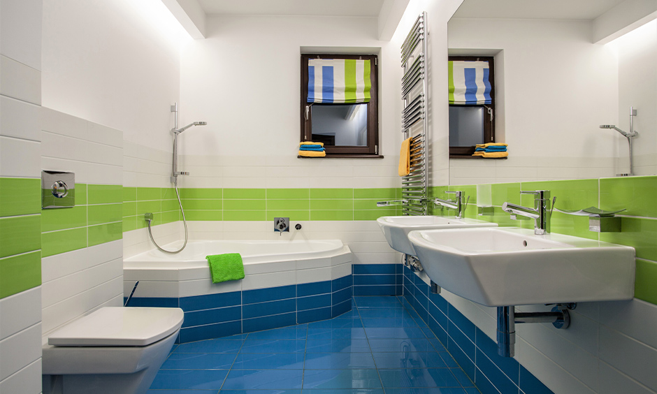 Bathroom in a combination of blue, green and white colours on the wall makes for a perfect kids bathroom idea with bathtub.