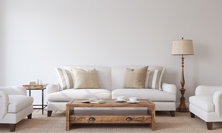 Vintage living room lamp next to the white sofa rich in design, layered brightness and subtle aesthete.