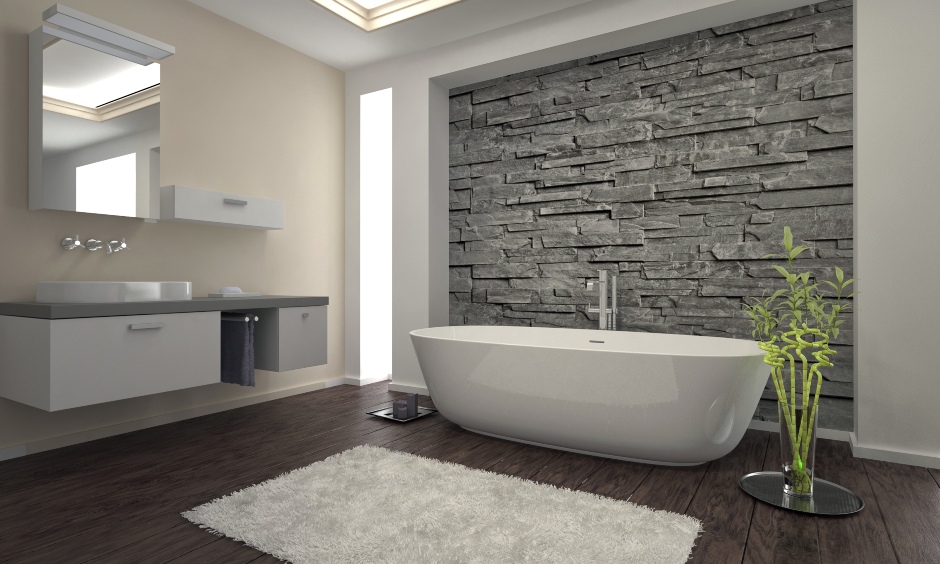 Minimalistic modern bathroom with an artificial stone wall cladding elevates the look of the space.